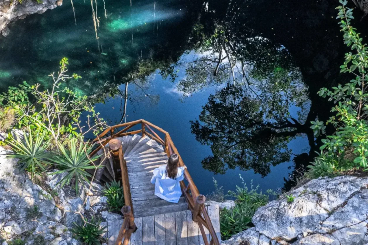 Guest walking to cenote at Destino Mio